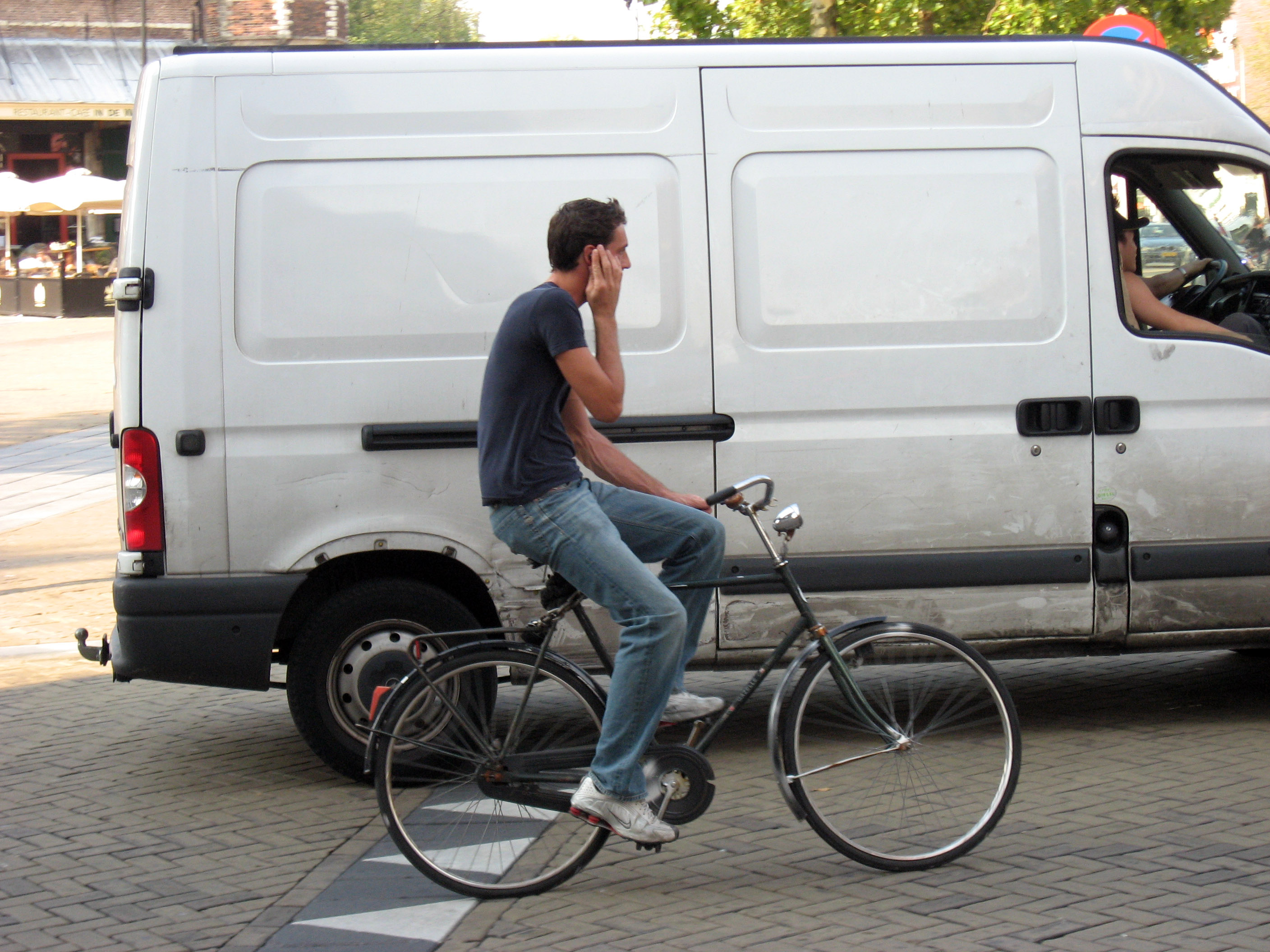 his bicycle in Amsterdam.